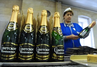 Moscow, russia, november 29, 2010, bottles of sovetskoye shampanskoye being packed in boxes at kornet, a moscow-based champagne winery.