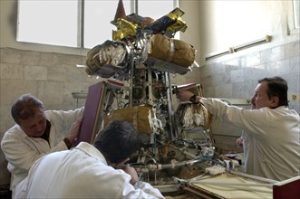 Specialists of lavochkin scientific production association prepare sunlight-propelled solar sail spacecraft for its launch, moscow region, russia, april 7, 2004.