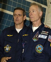 Moscow region, russia, september 9, 2005, members of the main crew of the 12th expedition to international space station (iss), american astronaut william mcarthur (l) and new space tourist gregory ol...
