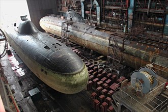Murmansk region, russia, august 10,2006, a view of the first soviet k3 submarine i`leninsky komsomoli^, background, which is currently on berth at the nerpa ship-repairing plant, navy museum exhibits ...