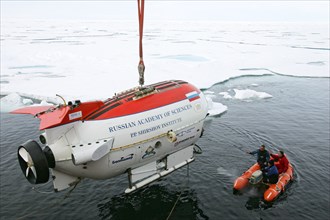 Arctic ocean, august 8, 2007, mir-1 submersible is being descent from the akademik fedorov research ship during the russian polar expedition 'arctic-2007'.