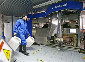 Operator is at work at the plemzavod rodina farm which is outfitted with delaval milking system, volgograd region of russia, february 5, 2008.