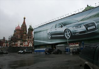 A billboard for audi automobiles in red square, moscow, february 2008, st, basil's cathedral is in the background.
