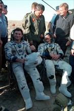 August 14, 1997, russian cosmonauts vasily tsibliyev and alexander lazutkin after the descending apparatus of the soyuz tm-25 spaceship