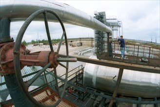Tyumen area, 1995, clearing and preparation of oil for submission in pipelines on the first pump station of the sugmut deposit, the sugmut deposit located among bogs between of nadym and purya, is one...