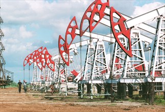 Oil derricks of' bashneft' company supplying oil to the refineries in the city of ufa , capital of bashkiriya, russia.
