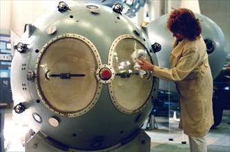An attendant of the russian nuclear weapon museum in the town of sarov cleaning a mock-up of the first soviet atomic bomb (rds-1 type), nizhny novgorod region, russia, august 25, 1999, the federal nuc...