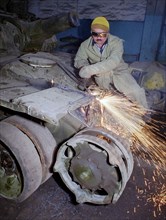 Welder sabir gadzhiyev cuts into pieces a soviet-made t-72 tank which is an item of obsolete military hardware subject to elimination under the treaty on conventional armed forces in europe, the first...