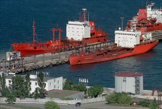 Maritime territory, russia, october 3, 2001, picture shows tankers being filled with fuel to be delivered to chukotka peninsula , the necessary 150 thousand tons of oil and lubricants will be supplied...