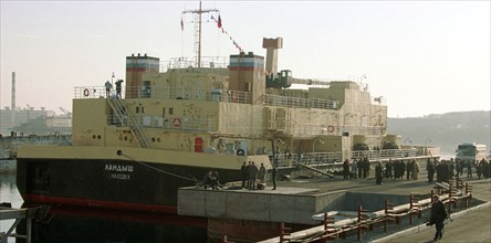 Maritime territory, russia, november 22 2001: unique floating complex for liquid nuclear waste reprocessing 'landysh' (lilly of the valley) seen moored to the quay of plant 'zvezda' (star) specializin...