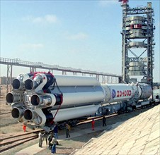 Baikonur, kazakhstan, april 25, 2003, rocket carrier proton-m (in pic) with the briz-m acceleration unit being transported to the launching pad of baikonur cosmodrome, proton, carrying the us ams 9 co...