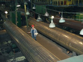 Finishing of a pipe product at the khartsizsk pipe plant, the main buyer of such pipes in russia is the gazprom company, donetsk region, ukraine, august 14 2003.