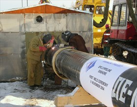 Welding of the first link of a 221 km-long pipeline that will transport hydrocarbon fuel produced at chaivo (chayvo) oil field from sakhalin island to the port of de-kastri in khabarovsk territory, th...