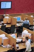 Brokers are pictured at their computers in the trading room at the moscow interbank currency exchange (micex), moscow, russia, 2006.