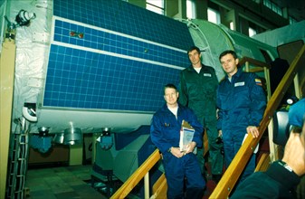 International space station, first long-term crew, from left: shephard, krikalev and gidzenko with zvezda service module, 10/00.