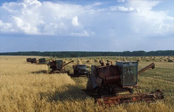 Harvesting combines at the urozhai collective farm in bashkortistan, russia, 1990s.