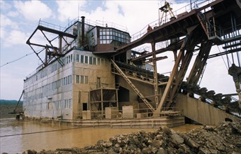 A gold mining dredge on the uderei river in the kasnoyarsk region of siberia, september 1996.