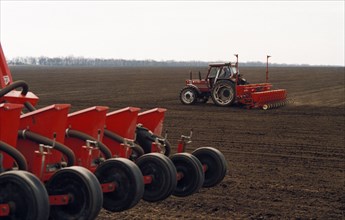 Tractors sowing sugar beets on a farm owned by the agris agricultural company in the novoalexandrovsk district, stavropol territory, russia, late 1990s.