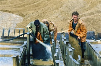 Separation (panning) of gold at the angara company's gold mine in the krasnoyarsk region of russia, december 1997.