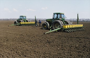 American made john deere tractors sowing sugar beets on a farm in the stavropol territory of russia, late 1990s.