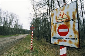 A sign warning of radiation and forbidding entry into the 30 km perimeter established around the site of the 1986 chernobyl nuclear accident, may 1998.