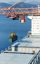 A russian container ship being loaded with chinese coal bound for japan, port vostochny, vladivostok, russia, 1999.