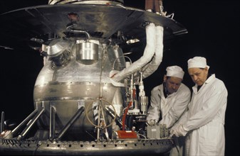 V,i, yegorov and n,i, antoshin, veterans of the soviet space industry, assembling the venera 13 or 14 space probe in 1981.