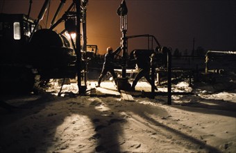 Working the night shift at the kustovoy oil field in the kogalymbsky oil province, tyumen region, siberia, 1990s.