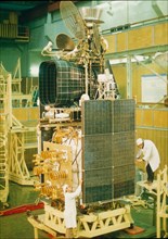 A meteorological satellite in assembly.