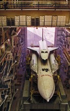 Soviet space shuttle buran with the energia carrier rocket in the hangar at baikonur in kazakhstan, 1988.
