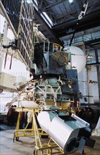 The soviet space probe vega 1 or 2 in the assembly and testing shop, the bottom of the platform carries video cameras, 1984, the international project included specialists from austria, bulgaria, czec...