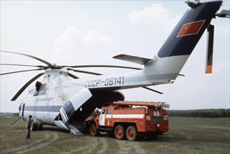 A truck being loaded onto a soviet mi-26 helicopter - the world's biggest, 1991.