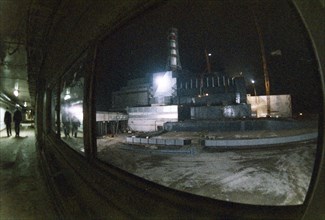 Chernobyl aps, ukraine, ussr, view of the unit 4 sarcophagus at night, december 1986.