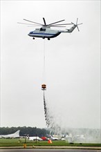 A russian mi-26 helicopter - the world's biggest - demonstrating it's fire-fighting capabilities at the farnborough air show in 1992.