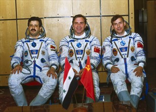 Soyuz tm-3, cosmonauts muhammed faris (syria), aleksandr viktorenko, and aleksandr pavlovich aleksandrov prior to their flight, 1987.