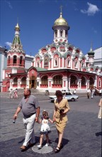 Russian family on red square in moscow,  russia, july 1999.