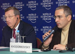 Moscow, russia, october 3, 2003, (l-r) exxon mobil's chairman lee raymond and yukos ceo mikhail khodorkovsky taking part in the work of moscow session of world economic forum on friday, where khodorko...