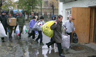 Chelyabinsk region, russia, october 29, 2003, inmates of the orphanage in the town of kopeisk (the ural area) and students of the chelyabinsk military automobile institute, which supports the orphanag...