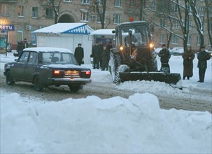 Moscow, russia, november 24, 2003, after night snowfalls there's a lot of work for snow-ploughs in moscow, according to weather forecasters the end of the november is to be warm and snowy.