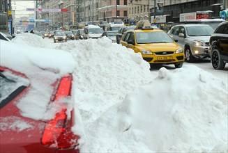 Moscow, russia, february 23, 2010, snow piles in a central moscow street.