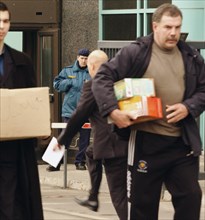 Moscow, russia, april 22, 2004, officials of the russian federal service for economic and tax crimes confiscated documents at the central office of the oil major yukos company.