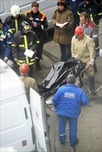 Moscow, russia, march 29, 2010, rescue workers carry the body of a bombing victim outside park kultury metro station, sokolnicheskaya line of the moscow underground, an explosion rocked the metro stat...