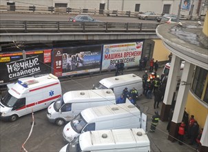 Moscow, russia, march 29, 2010, ambulances and rescue workers outside park kultury metro station, sokolnicheskaya line of the moscow underground, an explosion rocked the metro station at 8,40 during t...