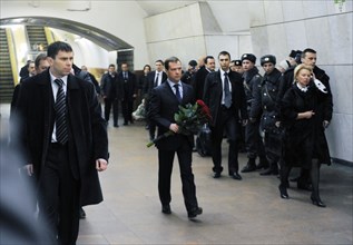 Moscow, russia, march 29, 2010, president of russia dmitry medvedev (?) lays flowers at lubyanka moscow metro station, the scene of today's suicide bombing, blasts rocked two stations on sokolnicheska...