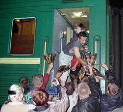 Irkutsk region, russia, august 11, 2004, residents of the village of slyudyanka, on the lake baikal, earn additionally selling fish on railway station.