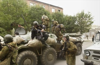 Special forces soldiers take position at a seized school in beslan, north ossetia, friday, sept, 3, 2004, commandos stormed a school friday in southern russia where hundreds of hostages had been held ...