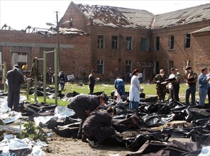 North ossetia, russia, september 4, 2004, victims' bodies, recovered by russian emergency workers from the debris of the school in beslan.