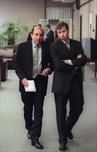 Russian mp's boris berezovsky, left, and roman abramovich walk down a hallway in the state duma [the lower house of the russian parliament], moscow, russia, june 23, 2000.
