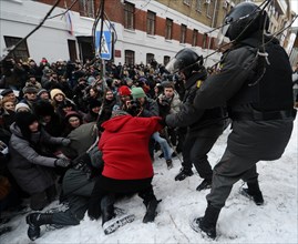 Moscow, russia, december 27, 2010, riot police scuffle with a demonstrator during a rally of khodorkovsky's supporters outside the khamovniki district court, the court is expected to issue its ruling ...
