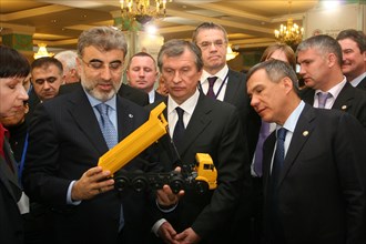 Kazan, russia, march 4, 2011, turkish energy minister taner yildiz, russian vice-prime minister igor sechin, and the head of tatarstan's regional government, rustam minnikhanov, (l-r front) view a mod...